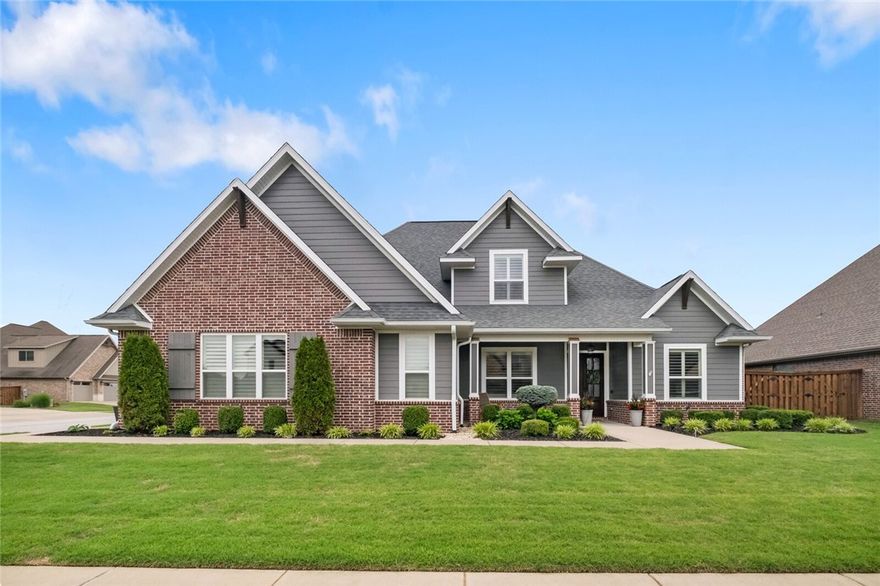 Pristine 4bdrm, 4bath home nestled on a corner lot in the highly sought-after Scissortail Subdivision in Bentonville. Step into this home and immediately be captivated by the quality & attention to detail seen in every single room. The vaulted ceilings, wood accents, hand-scraped hardwood floors, picture windows along the back of the home, & large living room open to the gourmet kitchen w/ wet bar are just a few notable things this home offers. Retreat to the master suite w/ gorgeous master bath & designer closet that opens to laundry w/ private mudroom. Upstairs are 3 additional bdrms w/ media room & wet bar. Enjoy sitting on the covered back porch overlooking the oversized, semi-private, professionally landscaped backyard and enjoy the oversized garage and walk in storage. This designer's dream is one you don't want to miss!