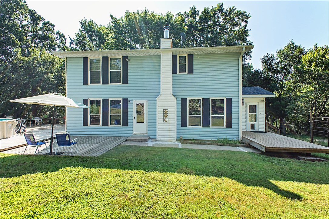 Beautiful 7.24 ac +/- private oasis on top of Trammel Mtn. Surrounded by 100+ y.o. oaks, pines, & flowering trees. Hard surface flooring throughout w/beautiful pergo wood flrs in LR & BR's. Spacious KIT fts corian countertops, pantry, ss app & bar area. MBR has walk-in closet. Nice mud rm & laundry rm w/laundry shoot. Deck provides the perfect place to sit back, relax, & enjoy the abundant wildlife or jump in the pool. Yard also has backstop for those handgun enthusiasts, & fenced in area for kids & pets.