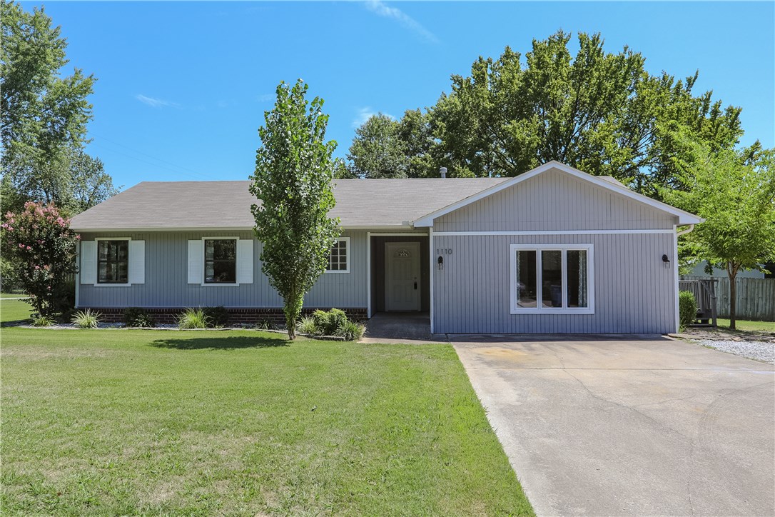 Completely remodeled 3 br 2 ba 1690 sq ft house on a 1/2 acre corner lot. Close to downtown, Walmart HQ, high school and Razorback Greenway bike trail. Fresh interior and exterior paint, plus NEW - roof, HVAC, stainless appliances, granite kitchen and bath counters, huge master shower, modern light fixtures, and curtains. Wood floors throughout. Huge 1/3 acre back yard with mature trees, privacy fence and lawn care included. Pets on a case by case review and subject to non-refundable deposit.