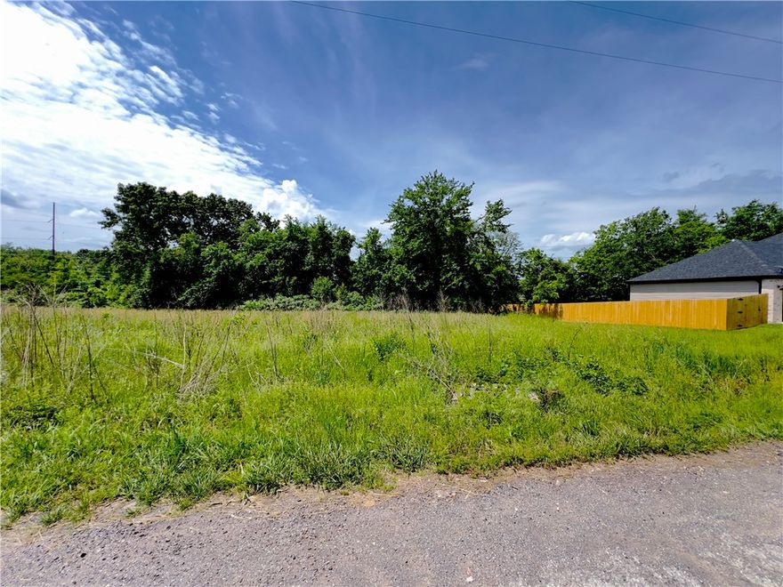 This lot is flat and provides quick access to I-49 and the Missouri state line and is conveniently located close to Highlands golf course and Branchwood recreation center. The percolation test has been done and is acceptable for a 2 bedroom home. Bring your own building plans and make this property your own today.