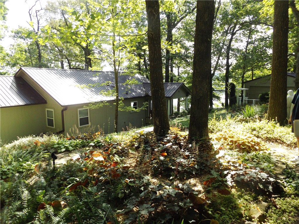 Wonderful one owner well cared for property. Views of the lake are amazing. Property has a gated entry. Property has 2 nice size pear trees and one peach tree. There is a little gold fish pond and lots flowers all over the grounds. Property sets on more or less 2 acres. This property has a boat slip that will convey. The appliances are new and have never been used. Property is very private and peaceful.