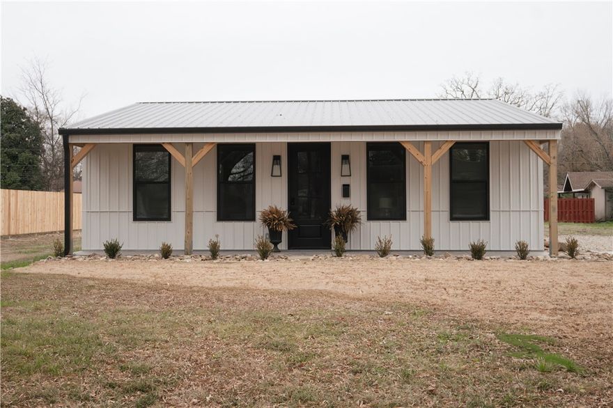 NEW CONSTRUCTION! EXTRAORDINARY HOME! Unlike any other! While offering a smaller footprint, this new construction is a smart way to simplify and easily maintain your life.  Not a "cookie cutter"---phenomenal, architecturally-pleasing design in every sq. ft. SELLER WILL SELL FULLY FURNISHED! Features high efficiency, stainless steel appliances-including washer and dryer. *Tankless water heater. All electric, 3 bedrooms 2 bath is in a convenient location and within walking distance to the university. Open floor plan entices enjoyable living plus ONE LEVEL. You will not believe the walk in shower! Cute kitchen offers well designed island with storage, premium appliances.  Covered, front porch and back patio will be your favorite place to enjoy the outdoors.  Fantastic yard with established lawn and new wooden privacy fence. 1500 sq ft under roof! WOODEN PRIVACY FENCE BUILT SOON!