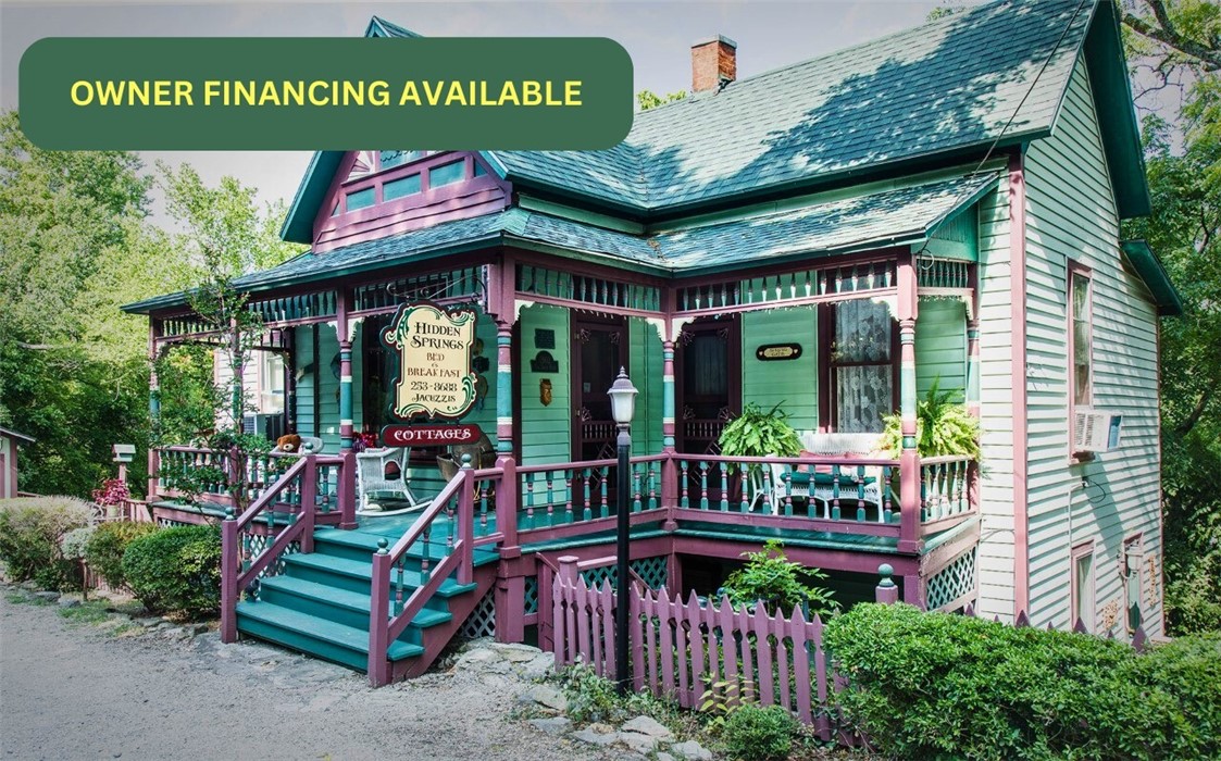 Are you ready to have your own profitable Bed and Breakfast and Wedding Venue? Hidden Springs Cottages operates from this historic Victorian, known as the ''Tobe Smith House.'' on the National Register of Historic Places, and could easily be utilized as a single-family residence too. Part of the rich history of Eureka Springs, one of Arkansas' most popular vacation destinations. It encompasses a full suite with a private bath and separate entrance for the kitchen, living area, and owner's quarters on the main level. The lower level has 2 full suites and a laundry area along with another bathroom owner currently uses as his private bath. 2 detached cabins are just a few steps away from the main home. The spacious Slumber Hill Cottage has a spectacular view of the Christ of the Ozarks from its private deck. The large deck has plenty of room for private parties. The property is sold completely furnished and ready for new owners. Downtown Eureka is just a few blocks away. Plenty of parking. Please preapproval needed.