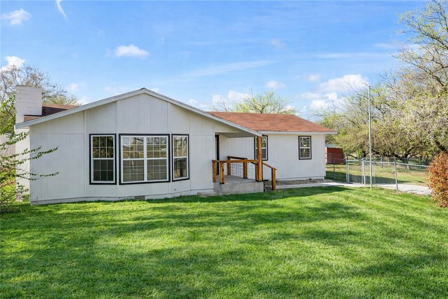 Fully remodeled 2024! Spacious 3 Bed 2 1/2 Bath charming home sitting on a .5 acre lot. Family room has oversized window and a cozy fireplace and is perfect for gathering to watch a movie or entertaining. Centrally located just minutes from JB Hunt, I-49 and only 2 minutes from the Razorback Greenway. Large fenced-in front/back yard with plenty of space to run and play, garden, and outdoor cookouts. You will love the privacy and being so close to everything NWA offers. The workshop/garage is attached to the office/bonus room and half bath making this a great opportunity for mechanic, trades, home office, and endless opportunities. Updated Wood Laminate floors, Siding, Interior/Exterior Paint, Trim, HVAC, Water Heater, Windows and LED Lighting. Nicely remodeled Kitchen with Granite counters and tons of cabinets. Updated Bathrooms, Vanities and Primary Closet. Storage Shed and plenty of parking. NO HOA Make this your new home!