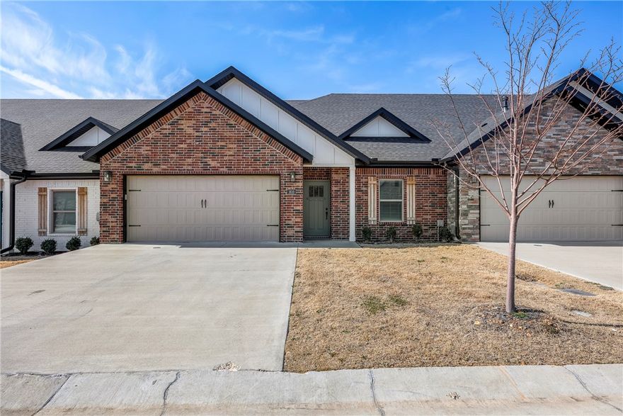 Newer 1,500sqft Townhome for lease in a great location close to Pinnacle Promenade Mall, Razorback Greenway Trails, Restaurants, Business Districts and I49. All one level 2-bedroom, 2-bathroom with 2 car garage. Open floor plan w/ gas log fireplace, LVP floors, granite counter tops, eat-in kitchen, pendant lighting, SS Appliances, pantry, tiled showers and walk-in showers. Private covered patio landscaped front yards. POA handles lawncare. Includes fridge, washer, and dryer.