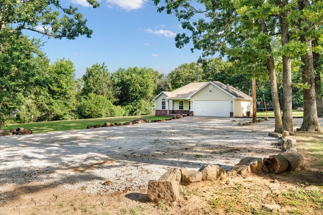 UPDATED FLOORING, BATHROOMS, KITCHEN AND -A NEW PRICE ! This beautiful micro-farm offers the charm of country living with modern amenities. The 1,658 sq ft home +/- features 4 bedrooms, 2 updated bathrooms, and a fully remodeled kitchen with new countertops, backsplash, fixtures, and appliances. Outsideā2+ acres more or lessāenjoy a deck overlooking woods, fruit trees, a 17x26 tilled garden ready for your green thumb, a chicken condo and run, a 350 sq ft powered shop with a 220v outlet, back porch, and lean-to for storage, a custom-built treehouse with a slide, swings, and observation deck for family fun. This property blends rural serenity with convenience.