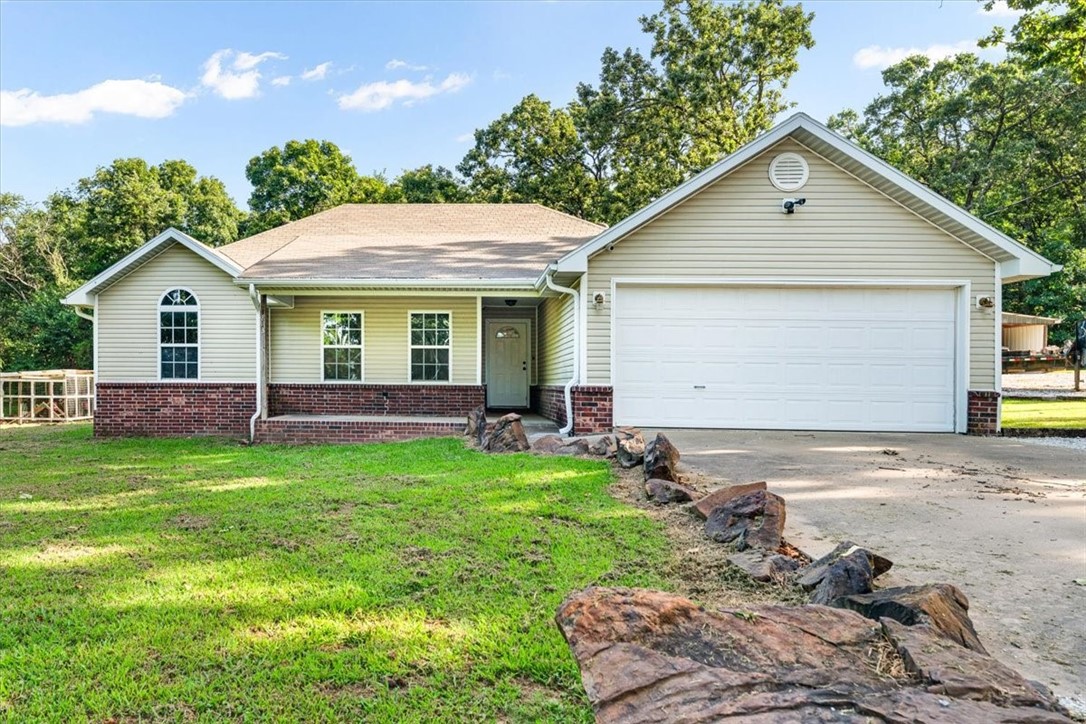 Possible Low Interest Assumable Loan--UPDATED FLOORING, BATHROOMS, KITCHEN AND -A NEW PRICE ! This beautiful micro-farm offers the charm of country living with modern amenities. The 1,658 sq ft home features 4 bedrooms, 2 updated bathrooms, and a fully remodeled kitchen with new countertops, backsplash, fixtures, and appliances. Outsideā2+ acres more or lessāenjoy a deck overlooking woods, fruit trees, a 17x26 tilled garden ready for your green thumb, a chicken condo and run, a 350 sq ft powered shop with a 220v outlet, back porch, and lean-to for storage, a custom-built treehouse with a slide, swings, and observation deck for family fun. This property blends rural serenity with convenience.
