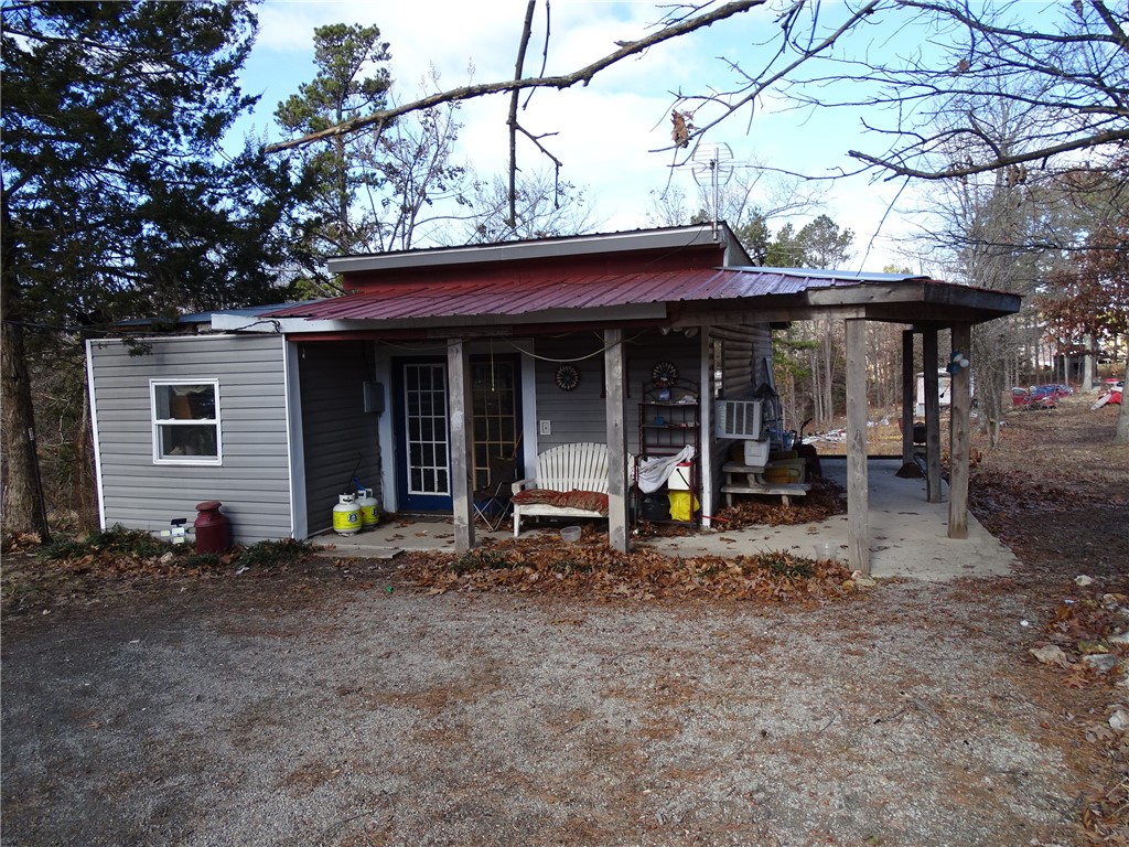 Looking for an investment opportunity? Or a place for the whole family? 3 homes on 20 acres m/l North of the town of Yellville, AR. Single wide with 1BD/1BA, a cedar cabin made from a walk-in cooler(very easy to heat and cool) with 1BD/1BA, metal roof and a full kitchen, and just next door is a 1 BR/ 1BA single wide that has been built onto. All 3 residences are currently rented, but can be flipped and sold, or move the whole family in for your own mini-compound. The 20 acres is mostly level and cleared with a portion still wooded along with some pasture as well. A private well supplies water to all the homes. No restrictions.