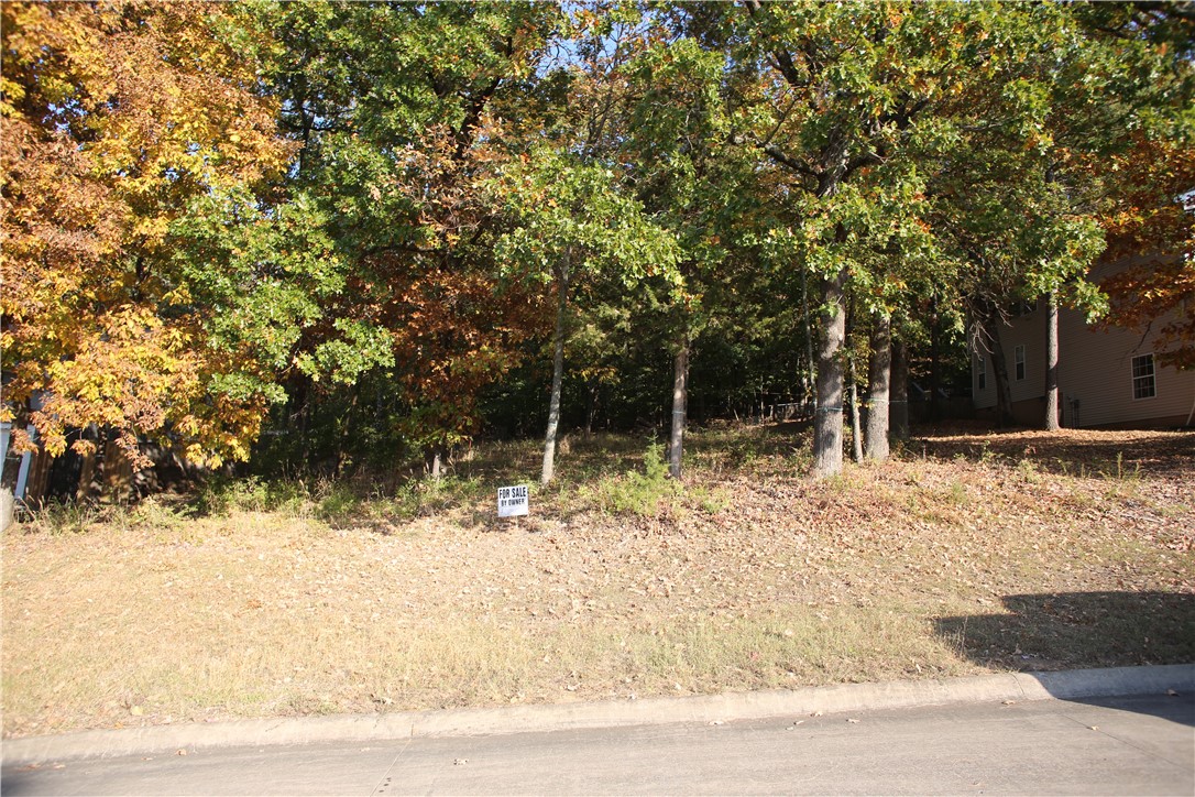 Beautiful wooded lot with great veiws. Centrally located. Root School District. Local Architect designed plans which have gone through Fayetteville permitting process can be included if desired.