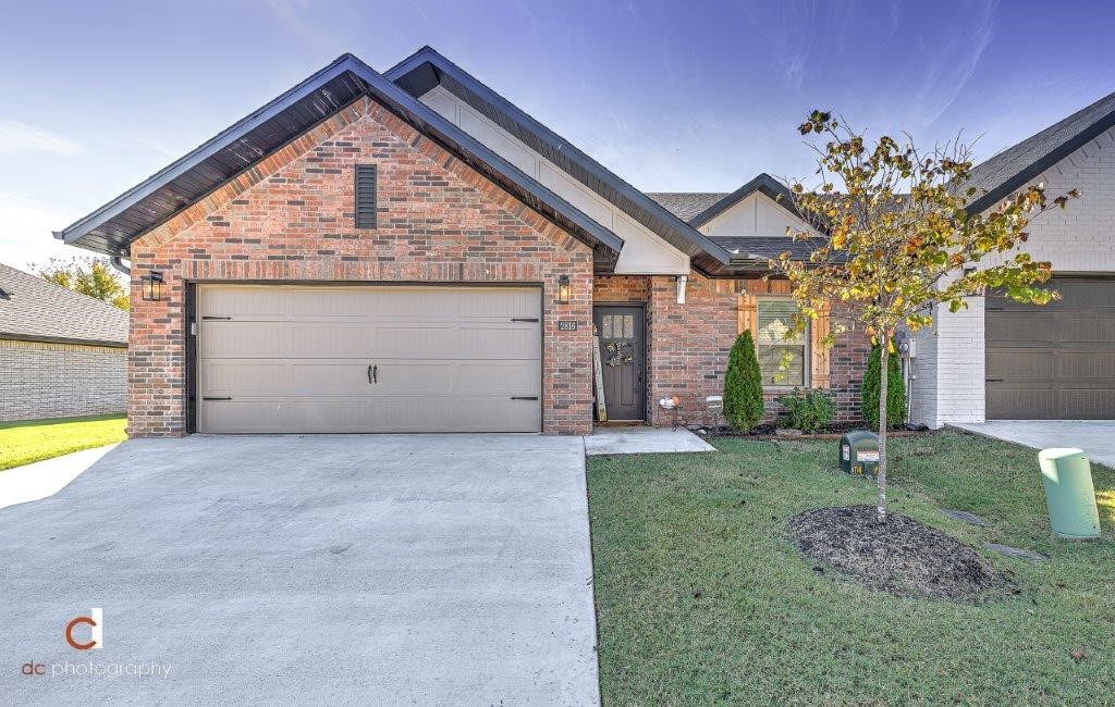 One level townhome has barely been lived in and is full of upgrades. Home was completed in Feb. 2021. Located on a dead end street w/access to the Razorback Greenway trails. Spacious laundry room adjoins the master walk-in closet for easy access to the master suite. Oversized walk-in shower. Gas fireplace w/tile surround. Open kitchen / living / dining area. Guest bath features shower & tub combo. Upgraded light fixtures plus tile & luxury vinyl flooring. No carpet. Quartz countertops in kitchen and both bathrooms. Gas cookstove. Pantry area. Built in shelving in kitchen. Covered patio w/fenced yard. POA fees include lawn maintenance. Two car garage.