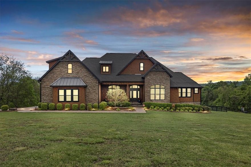 Exquisite estate nestled on 13.44 private acres in Goshen, just minutes from Fayetteville. Spanning 5,000 sqft, this stunning home features five bedrooms and four bathrooms, showcasing craftsmanship from superior construction to luxurious designer finishes.
Enjoy breathtaking landscaping accentuated by natural Arkansas rocks, unwind in the hot tub under the stars, or host memorable gatherings at the outdoor kitchen. Movie nights are a breeze in the private theater room. The interior boasts professional-grade appliances, custom cabinetry, granite countertops, and premium details throughout.
Additional highlights include a spacious 40x60 shop with dedicated living quarters and two 50-amp RV hookups, perfect for hobbies, storage, or guest accommodations. This remarkable property offers a perfect blend of privacy, luxury, and versatile outdoor living in a peaceful rural setting close to Fayetteville. List of upgrades attached.