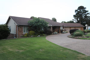 This beautiful home on the west side of Russellville gives you fabulous views down into the city of Russellville! One of only a handful of homes this large with an in-ground swimming pool. There's a wonderful sunroom that overlooks the luxurious 20 x 40 heated, salt-water pool and has panoramic views into the valley. Some special amenities include a heated master bath floor, sprinkler system, large room set up for hot tub/spa and a pool house complete with full bath and room for microwave/fridge. This home has 4 or 5 bedrooms, 4 full baths, and 1 half bath. Roughly 4,400 heated and cooled square feet. Breakfast room adjoins the nicely appointed kitchen. Fenced back yard, and don't forget the 3 car garage.