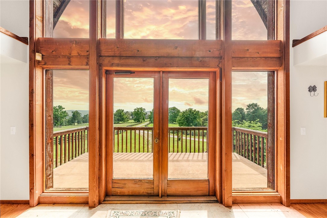 Outstanding Opportunity! Approx. 184 Acres with an incredible horse stable/wedding venue building designed by Maurice Jennings. This building reflects Fay Jones style and was built many years ago at a cost of over $800,000. Living Quarter, professional horse stalls, unbelievable woodwork. Also a metal barn/shop with working pens on the acreage, fenced and cross-fenced for cattle and pasture rotation.
Beautiful rolling pastures, some mature forest land offering elevated views for miles. Private setting close to Fayetteville. Owner retains a road and utility easement to his home adjoining the property.