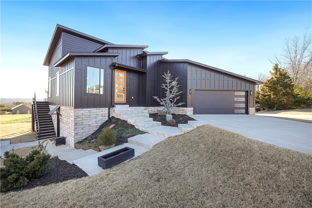 Modern but cozy 3 bed, 2.5 bath custom designed 2554 sq. ft. home built in 2020. Beautiful views of the Ozark mountains from almost every Pella picture window. Fully landscaped with privacy in mind. Newly installed 6ā cedar privacy fence. Full kitchen upstairs and downstairs. Custom glass railing inside and on outside deck to optimize your view. Automated blinds and lights throughout. Great entertaining spaces everywhere you look. Stamped concrete covered patio leads to a heated saltwater pool. In the cooler weather, enjoy sitting around the custom welded steel fire pit. For the green thumbs, thereās also a greenhouse and raised garden beds. Heated shop plus bathroom and covered lean-to for RV hookup or boat storage. Paved asphalt drive. All of this sits on 3.25 acres, 1 mile to Beaver Lake boat ramp, 15 min to Fayetteville and 35 min to XNA airport.