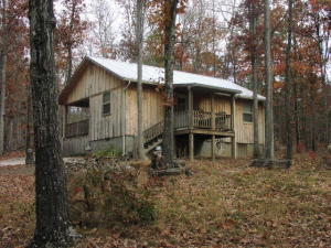 Very nice get-a-way/vacation/permanent residential 2 bedroom, one bath cabin on a dead end road. Easy access just outside of Jasper. This cabin would also make a great nightly rental. Lot of woods surround this 1.5 acre parcel. (more land available). Close to multiple access areas of the Buffalo National River.