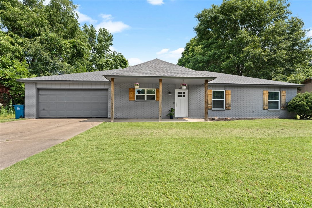 This is the one! Walk or bike to Walmart Home Office, Thaden School, the Bentonville Square, and the Razorback Greenway that connects everything in NW Arkansas. Not only is your new home close to all things Bentonville, it's adorable to boot! You'll love the easy to maintain wood flooring in the living areas and brand new plush carpet in the bedrooms. The kitchen is so bright and cheerful with gorgeous granite countertops and subway tile backsplash. The living area boasts a beautiful fireplace and opens onto your patio and big, fenced back yard. In addition to the three spacious bedrooms, there is a bonus office/studio/gym...you name it...in a quiet, private space; perfect for working from home. The bathrooms have lovely granite countertops, brushed nickel fixtures and modern tile. The entire home was remodeled in 2018 including the roof, and the water heater is brand spanking new! You simply won't find a cuter home in a better location. Schedule your personal tour today!