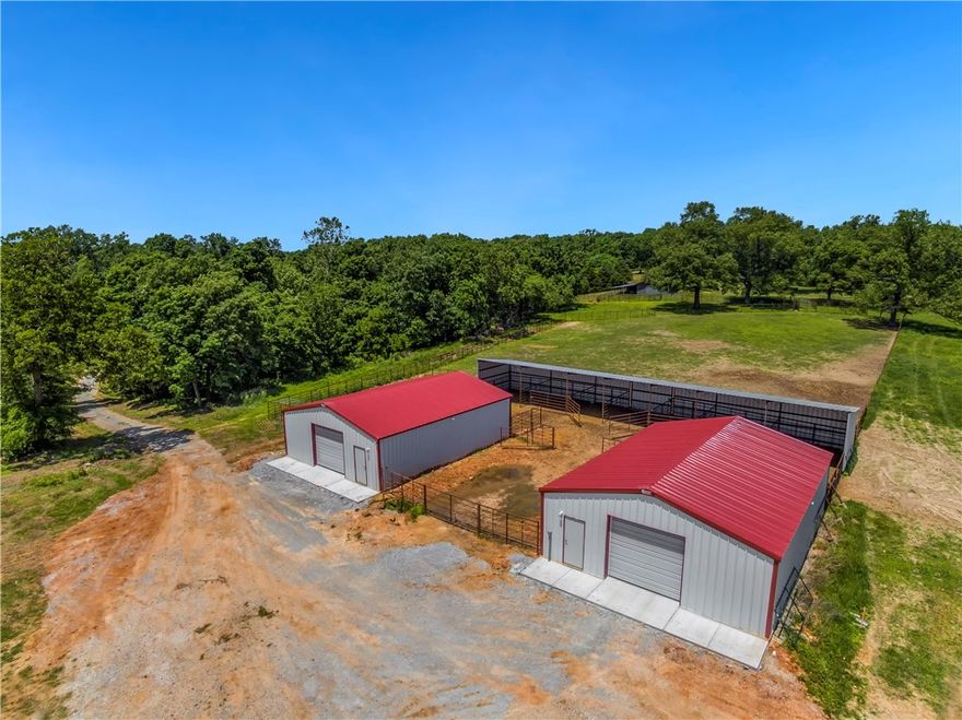 298.32 acre +/- cattle/horse ranch. Multiple beautiful homesites w/views. 2 NEW 40'x30' Central States Mfg insulated concrete floored metal bldgs. NEW 16'x90' metal lean-to with new welded working pens, 4 sorting pens, loadout & 2 extra large catch pens. 3 freeze-proof hydrants. NEW 60'x40' metal shop bldg w/attached H/C 24'x12' office w/1/2 bath. Attached 60'x12' & 36'x12' lean-to's w/freeze-proof hydrants. 15 ponds. Fences & cross-fenced. Fayetteville or Springdale schools. 20 min to Crossover Rd.