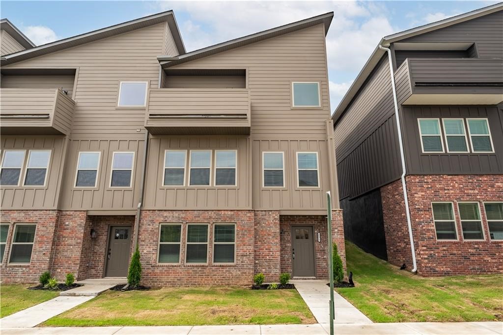 Nestled in the heart of Fayetteville, this modern townhome offers the perfect combination of luxury, convenience, and comfort. This townhome has 2 living areas, 3 bedrooms, 2 and a half baths, and 2473 square feet of living space, this residence provides ample room for your family to flourish. The kitchen features granite countertops, stainless steel appliances, a spacious island, and custom cabinetry, making it the perfect space for cooking and entertaining alike. This townhome offers easy access to I49, top-rated schools, shopping centers, dining destinations, and recreational facilities, ensuring that everything you need is minutes away. Fridge, washer, and dryer included.