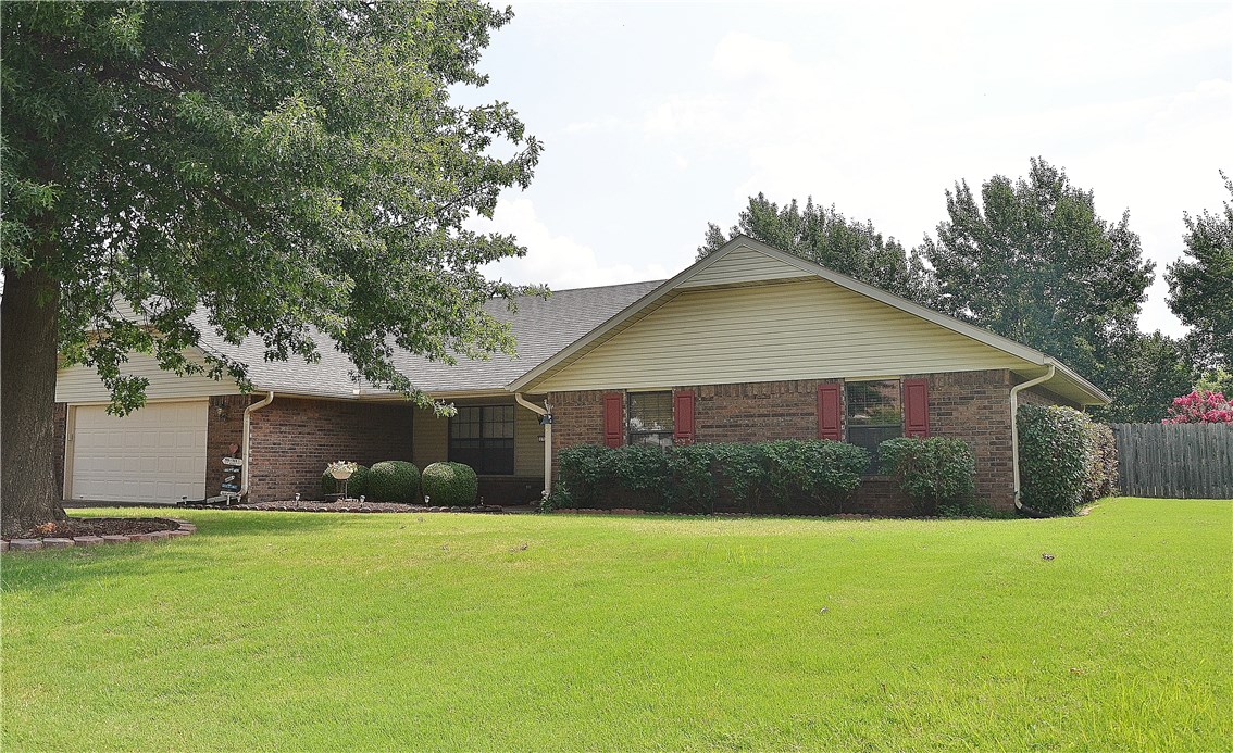 Tranquil setting with a peaceful backyard, just minutes from I-49. This brick home is immaculate with extra large rooms and a sunroom which is not included in the square footage. Extra features include: storm shelter/safe room conveniently located in the garage, tank-less water heater, spa in master bathroom, handicap-accessibility, solar tubes for natural light in bathrooms, island in kitchen, his and hers closets in master bedroom, large pantry, attic fan and extra storage in utility room and garage.
