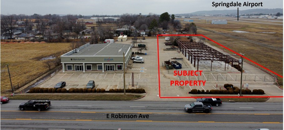 A unique opportunity. A 8815 SF structure with exterior damage in the March 2022 tornado. Hwy 412 frontage on 1.62 AC. The clear span red steel manufactured frame has been cleared. The building can be designed to fit your business needs. Property sold "AS IS".