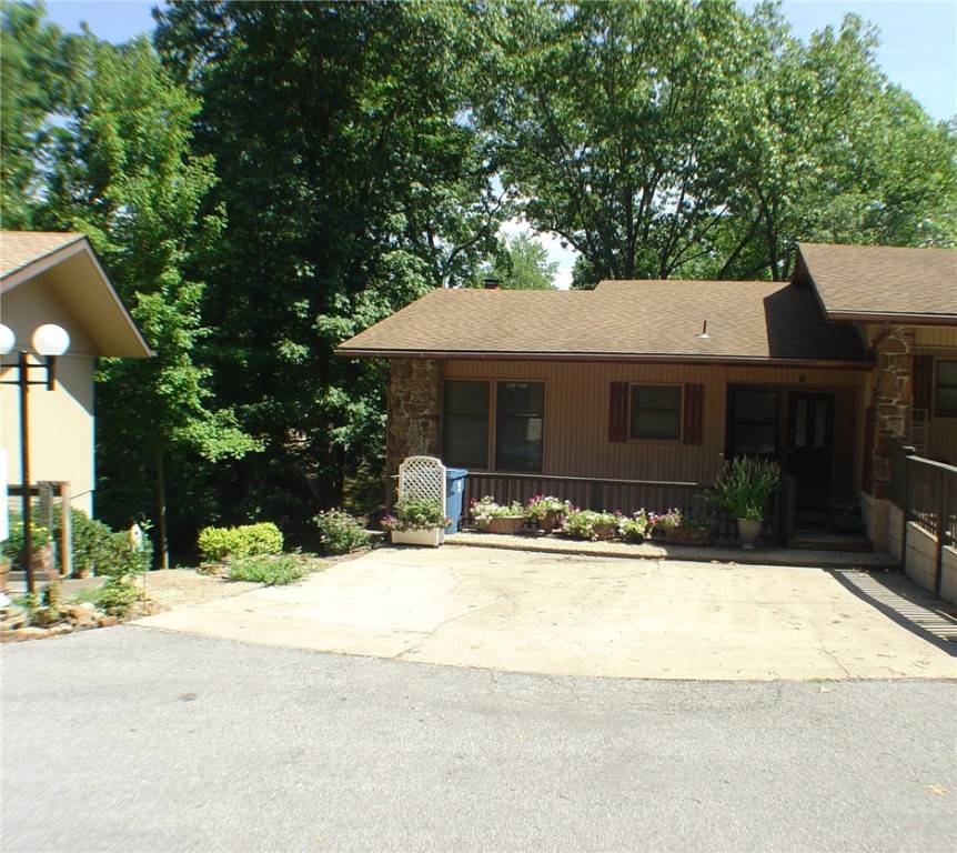 Calling all Airbnb Hosts! This spacious and inviting end unit townhome is located close to Riordan Hall and Kingsland Golf Course as well as parks, playgrounds, trails, tennis courts, pools and rec facilities. Your guests can bring their bicycles or hiking boots and hit the trails in no time. Four total bedrooms (one without a closet), makes this a great income producing home! A beautiful stone fireplace is the focal point of the living room. Brand new dishwasher! All appliances convey, including washer and dryer. Master with en suite bath is located on the entry level. Two more bedrooms and another full bath are on the lower level as well as a large bonus room that could be used as a 4th bedroom, but does not have a closet. Bonus room would be perfect for a home office, craft room or extra storage. All three bedrooms have sliding glass doors that lead out onto a deck. New roof and gutters May 2021.