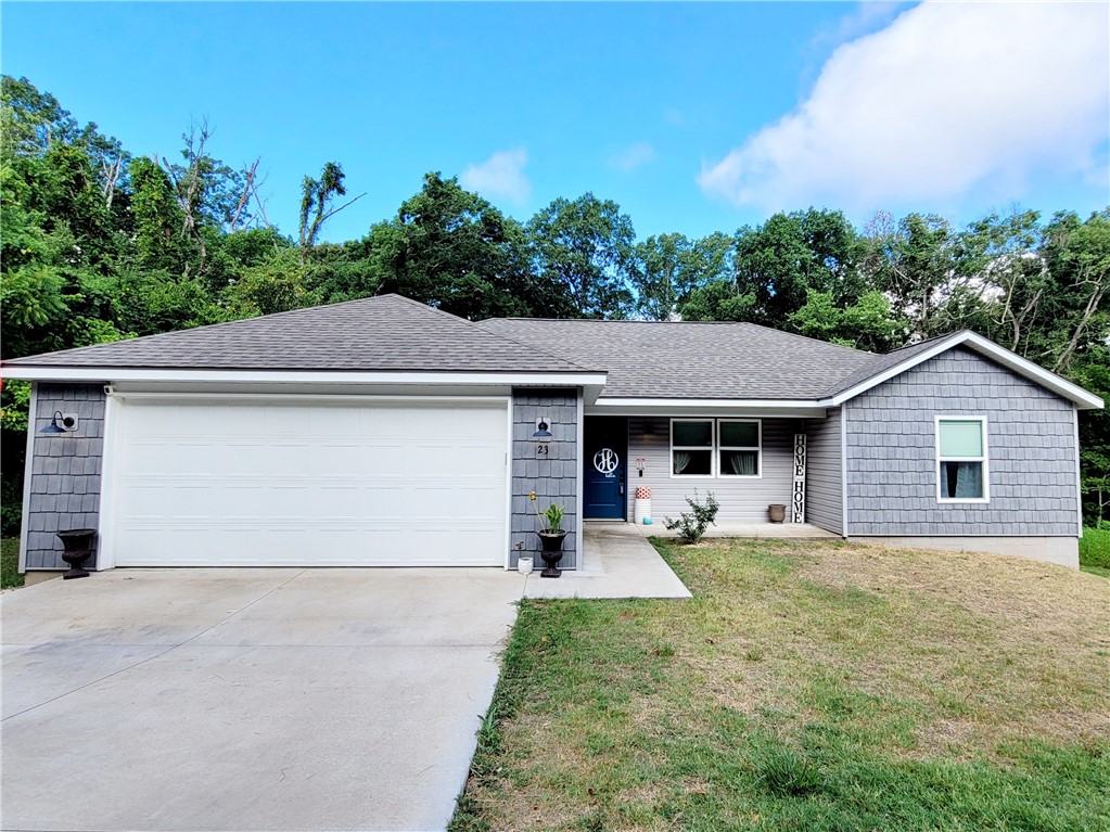 Like new 2019 built home in the fast-growing NWA! This home features an open concept floor plan with a spacious kitchen, dining and living room! Split floor plan with two bedrooms with an office/bonus room, 2 bathrooms and a 2-car garage. Enjoy natures beauty all around in your spacious front and back yards with mature trees all around! Convenient to all NWA has to offer!
