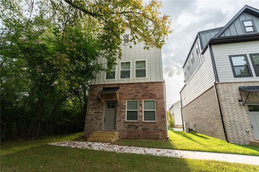 Brand new 2 BR/2 BA townhomes in south Fayetteville located close to U of A, Baum-Walker Stadium, The Ramble, Razorback Greenway, I-49, and all of Fayetteville's downtown area. This beautiful home features luxury vinyl plank throughout. The primary bedroom, kitchen and living area are on second level with the second bedroom and utility room on the first level. Kitchen has a pantry and both bedrooms have walk-in closets. Tub/shower combos in both baths. Third floor loft provides flex space. 2 car garage. Agent owned.