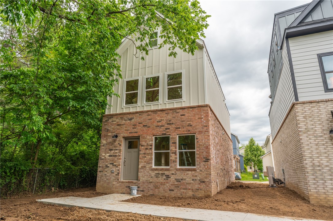 Brand new 2 BR/2 BA townhomes in south Fayetteville located close to U of A, Baum-Walker Stadium, The Ramble, Razorback Greenway, I-49, and all of Fayetteville's downtown area. This beautiful home features luxury vinyl plank throughout. The primary bedroom, kitchen and living area are on second level with the second bedroom and utility room on the first level. Kitchen has a pantry and both bedrooms have walk-in closets. Tub/shower combos in both baths. Third floor loft provides flex space. 2 car garage. Agent owned.