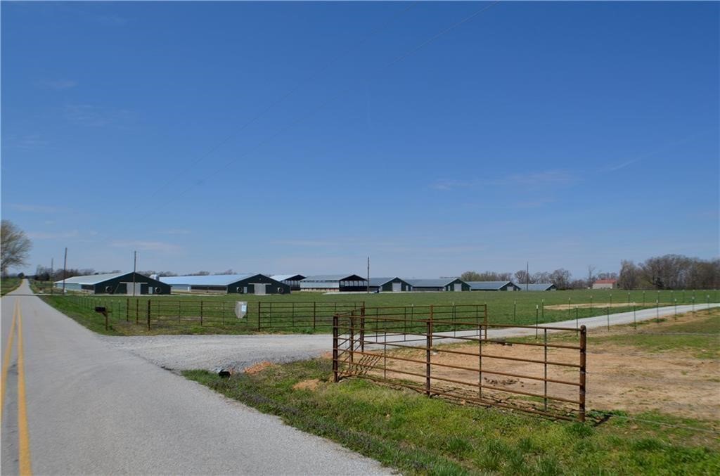 Very nice mid size farm in a great location with all the amenities. Natural gas, well, rural water on pavement. (2) 66 X 600 and (4) 43 X 500 all fully updated. 2 stacking sheds. Eco drum system. Large well house/shop. Tray wash system. 4 bedroom large newer brick home and large garage/shop with cattle grazing and corral system. Great fishing and hunting as well. Rural but not too far from town.