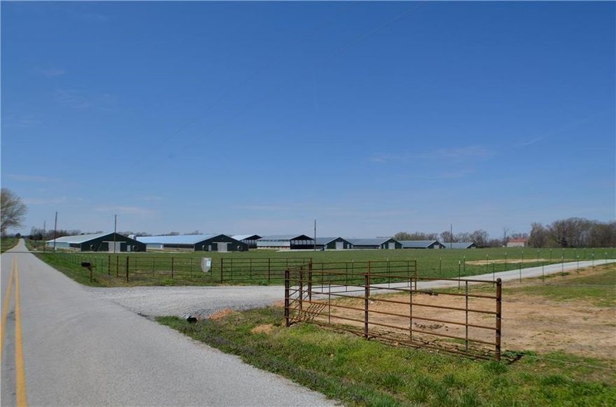 Very nice mid size farm in a great location with all the amenities.  Natural gas, well, rural water on pavement. (2) 66 X 600 and (4) 43 X 500 all fully updated. 2 stacking sheds. Eco drum system. Large well house/shop. Tray wash system. 4 bedroom large newer brick home and large garage/shop with cattle grazing and corral system. Great fishing and hunting as well.  Rural but not too far from town.