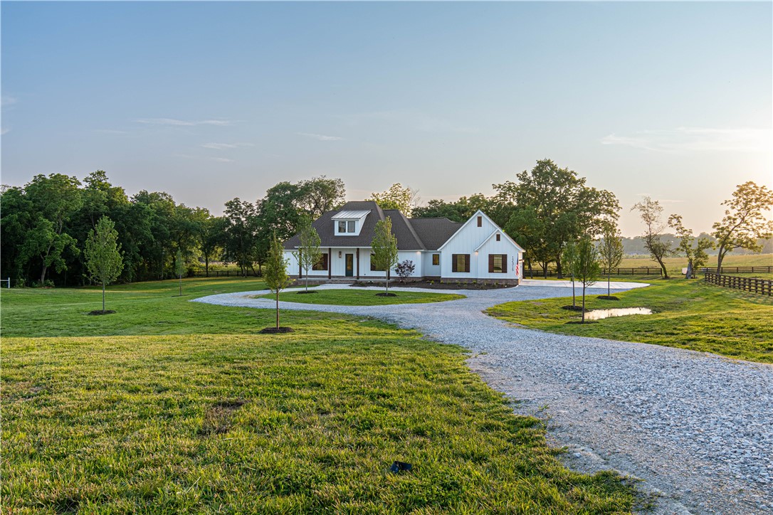 Truly remarkable new construction home on three acres!! Be a part of this estate community within 25 minutes of Fayetteville and Bentonville! This home sits on 3 acres surrounded by post and rail fencing offering a unique vibe to Northwest Arkansas. Kick back and enjoy the sunset and wildlife on your massive covered back porch!! Or step inside the family room to warm up in front of your 48" wood burning fireplace!! Concrete enclosed pantry, formal living room built ins, soaker tub in master, whole home generator ready, natural gas and city water, instant hot water, plush finishes throughout, all of which along with the setting make this a home one to never forget. Approximate completion sometime in April 2023.
