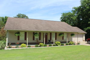 IMMACULATE & MOVE IN READY! This adorable home has 3 bedrooms, 2 baths and has Gar Creek running along the back of the property. There is a nice covered front porch, back deck, fenced in yard, storm cellar, and outbuilding. Sit on the back deck and enjoy the tranquility of the babbling creek! The only thing missing in this home is YOU. Call today to make a personal tour.