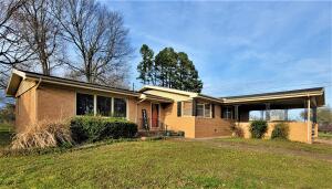 Large brick home with 3 bedrooms and 2 1/2 baths located on a quite cul-de-sac in Western Hills Subdivision. Lots of space with good size rooms, large bathrooms with granite countertops, walk-in closet and whirlpool tub. The large outbuilding outbuilding could serve as a workshop or man cave/ she shed.