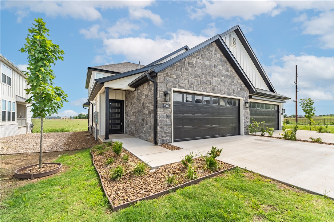 This beautiful new construction townhome offers Great location close to Osage creek elementary and Creekside middle school, close to the new Creekside park, close to the trails at Bentonville, Pickle ball courts and a pavilion. A short drive to Walmart general office. Come see this property in this new and up and coming area. Lawncare is providing by the owner!! , surrounded by a vibrant green landscape. Come inside to find an open concept floor plan complete with modern touches and finishes. The kitchen features stunning white cabinetry with matte black fixtures, a spacious center island, and sleek stainless steel appliances. With 3 beds, 2.5 baths, a 2-car garage, and a serene backyard view, this home is the perfect place to call home. Located minutes away from all the best Bentonville has to offer - don't miss out on making this townhome your new home! Schedule a showing today.