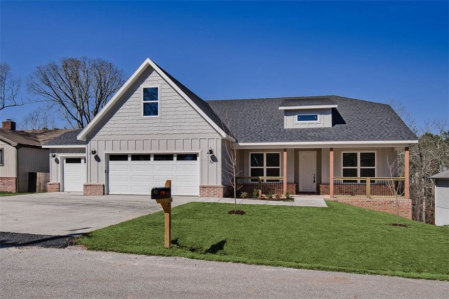 New construction on a .40 acre wooded lot! Located next to Scotsdale Golf Course, Loch Lomond Marina, and Tunnel Vision Trail! Features include a spacious 3-car garage with epoxy floors, 3 bedrooms + upstairs bonus room with full bath. Wood flooring. The kitchen is equipped with a large island, 3 cm quartz counters, custom cabinets, stainless steel appliances, and a gas range. The living room boasts a beautiful fireplace, exposed beams, and a stunning cathedral ceiling. The primary bath features a luxurious soaking tub, separate vanities, and a huge walk-in closet with a custom tile shower. Custom finishes throughout. $3,500 in closing costs when using the builder's preferred local lender.