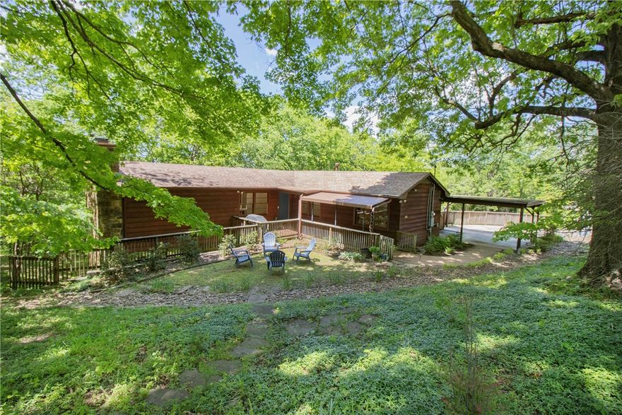 Nestled just two blocks from the iconic Razorback Stadium, 629 N Gray Ave offers a unique blend of serenity and convenience. This charming home sits on a peaceful, park-like .75-acre lot, providing a rare sense of privacy so close to the University of Arkansas campus. The living room is a true highlight, featuring beautiful hardwood floors and an abundance of windows that flood the space with natural light and offer gorgeous views of the backyard forest. Step outside to the spacious screened porch on the lower level, complete with a cozy fireplace—perfect for cool evenings and enjoying the calming beauty of your private backyard. This home offers the rare opportunity to live just moments away from all the action of the U of A, while enjoying the peace and privacy of a quiet, nature-filled retreat.
Don’t miss the chance to own this exceptional property—contact us today to schedule a showing!