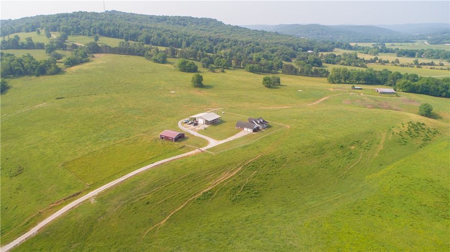 This incredible property is a rare find! Home on a working cattle farm, shop with studio apartment, Hwy 23 frontage, War Eagle River frontage, year-round creek frontage, scenic views from every vantage point. Quality built 3br+office/flex 2.5ba 2080sqft m/l brick & vinyl home. Split floor plan, great use of space, custom storage, HVAC/outdoor wood furnace/propane backup heat sources. rural water & well. 30x50 insulated shop w/600sqft studio apt, covered patio, 12x50 overhangs each side. 40x40 barn w/tack room, stalls, water/electric. 45x60 hay barn, steel working pens. 4 pastures fenced/cross fenced, running 40-50 cows. 2 stocked ponds, 3 freeze-proof water tanks. Situated on 120 m/l mostly open acres lying east of Hwy 23 with approx 1300ft hwy frontage. Lying west of Hwy 23 is 58 m/l acres of mostly open hay meadow, approx 2600ft War Eagle River frontage. Gentle river access with drivable road. The details and amenities of this exceptionally maintained property are far too extensive to address. Take a look today!