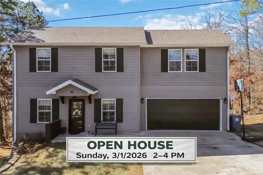 Welcome home to this beautifully maintained 3 bedroom, 2.5 bath retreat in Bella Vista, perfectly positioned surrounded by nature and just minutes from Lake Ann and the renowned Back 40 Trails. Built in 2020, this home offers a clean, modern feel with brand new carpet and fresh interior paint, making it truly move-in ready. The open layout provides comfortable living and entertaining space, while large windows bring in natural light and showcase the peaceful, wooded surroundings.