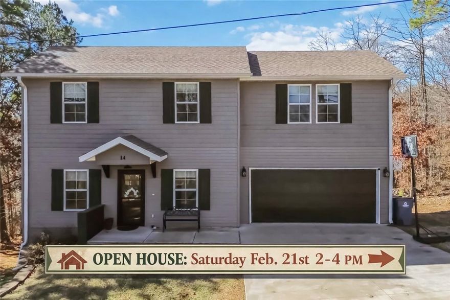 Welcome home to this beautifully maintained 3 bedroom, 2.5 bath retreat in Bella Vista, perfectly positioned surrounded by nature and just minutes from Lake Ann and the renowned Back 40 Trails. Built in 2020, this home offers a clean, modern feel with brand new carpet and fresh interior paint, making it truly move-in ready. The open layout provides comfortable living and entertaining space, while large windows bring in natural light and showcase the peaceful, wooded surroundings.