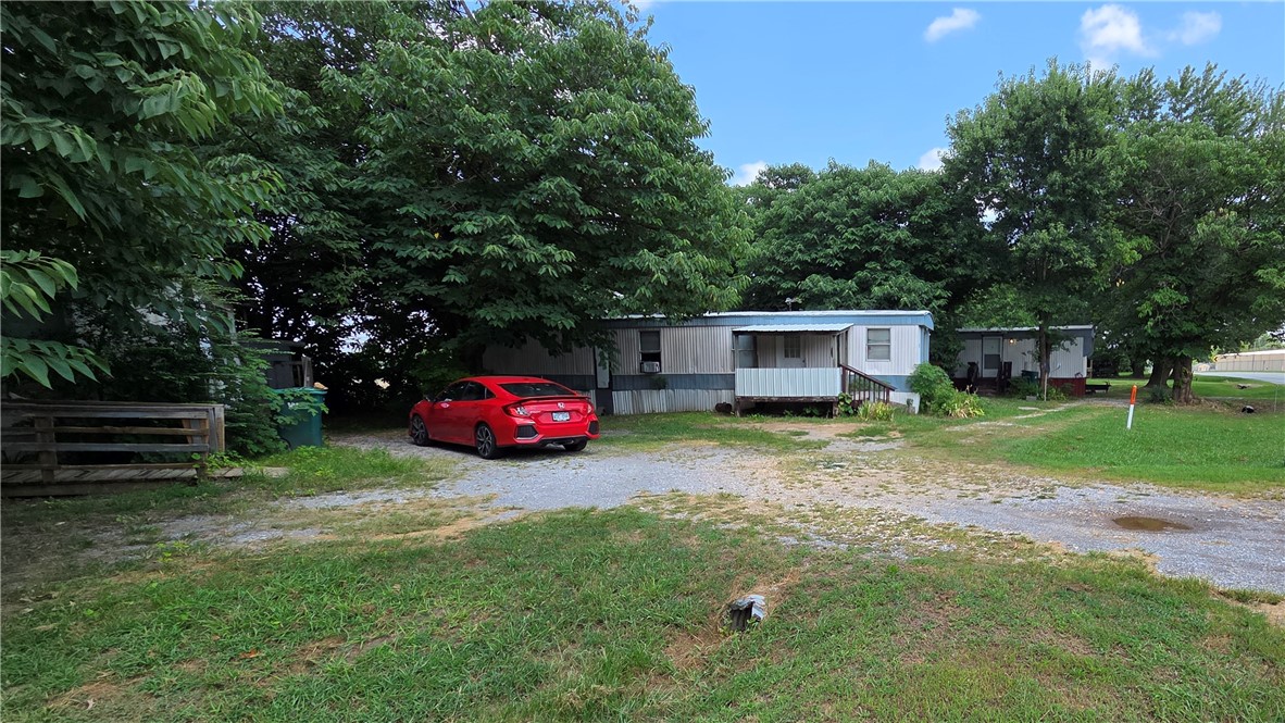 Great rental income from three mobile homes that stays rented. There is a fourth mobile home on property could be hooked up & rented for additonal income.