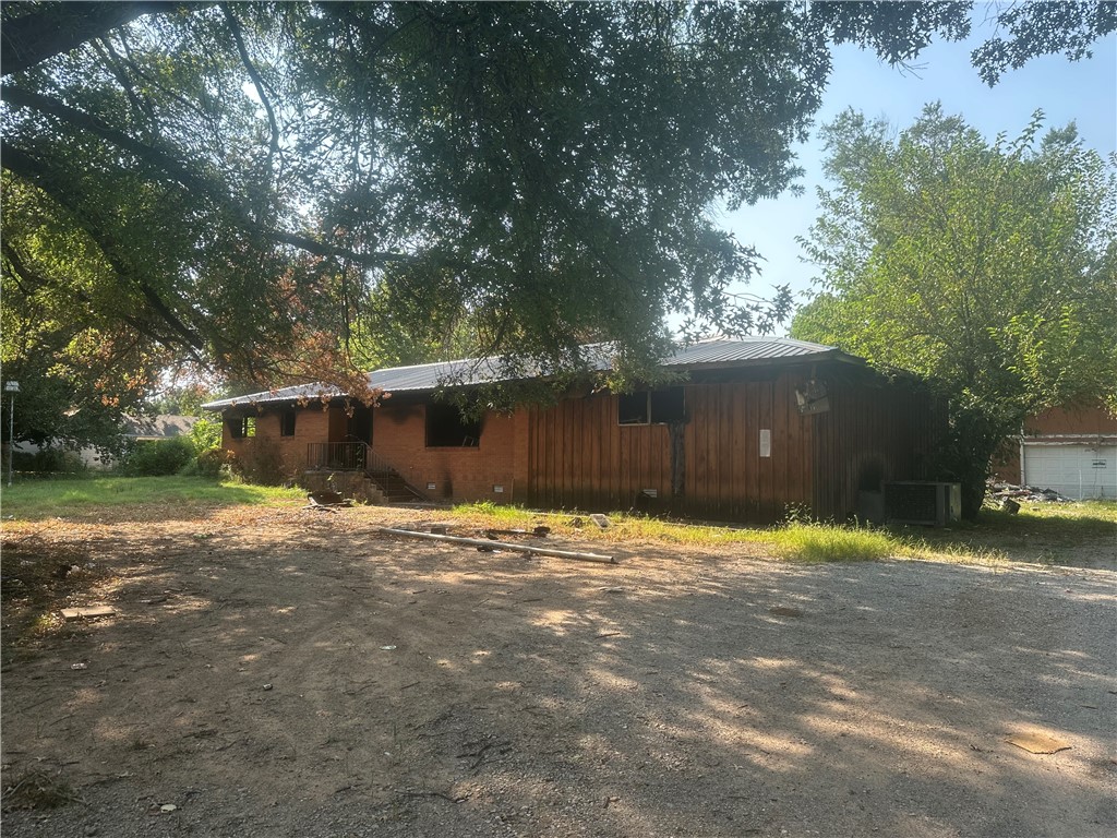 Residential building lot with burned out house. Will need to remove house before building. Large oversize lot approximately .69 of an acre m/l