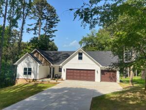 Beautiful brand-new construction in a desirable West Russellville location offers privacy while being close to town. Zoned for Sequoyah Elementary. The open floor plan features a vaulted ceiling in the living room, stylish modern fixtures, and granite countertops. The kitchen boasts abundant cabinetry and large windows that fill the home with natural light. This 3-bedroom, 2-bathroom home has a split floor plan with a comfortable multipurpose space upstairs, perfect for a playroom, game room, or office. Enjoy the great back deck and the 2-bay, 3-car garage. Don't miss this stunning home, call for your showing today!