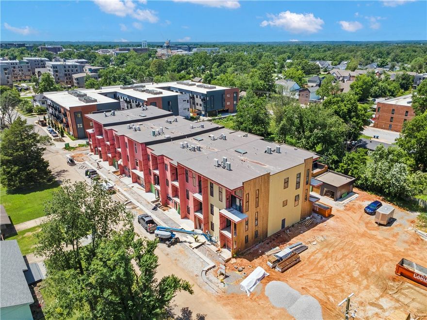 Perfectly positioned between the new Walmart Campus and the vibrant Downtown Bentonville Square, The Downtown Haven offers refined urban living with walkable access to art, culture, and culinary experiences. This community includes just 29 thoughtfully designed residences.
 Unit 203 – The Rockwell celebrates timeless design with a modern edge. A 261 sq ft private patio with an outdoor storage closet extends your living space, while a large triple-paneled sliding glass door brings in abundant natural light and a seamless indoor-outdoor flow.
The well-appointed kitchen features a 4-person island with waterfall edge, ample cabinetry, and a clean, contemporary layout ideal for entertaining. The residence also includes a private one-car garage, offering both security and convenience. Whether you're seeking low-maintenance luxury, a lock-and-leave lifestyle, or the perfect downtown Bentonville landing pad, The Rockwell delivers elevated living in every detail. Ready in October.