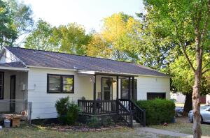 This home is perfect for you if you're looking to downsize, or you're in the market for your first home, Look at this cozy 2-bedroom cottage. It has a nice kitchen, hardwood floors in the living room and a covered porch. The ''other'' room is a huge walk-in closet off the second bedroom. It's big enough that it has been used as a nursery at one point. Your new home sits on a corner lot in a quiet neighborhood. It has a one car attached garage. There aren't many homes in this price point that are move in ready. All this, plus you will get a brand new roof. The seller is offering a $6,000 roof allowance or they will replace it before closing and you can help pick the color.