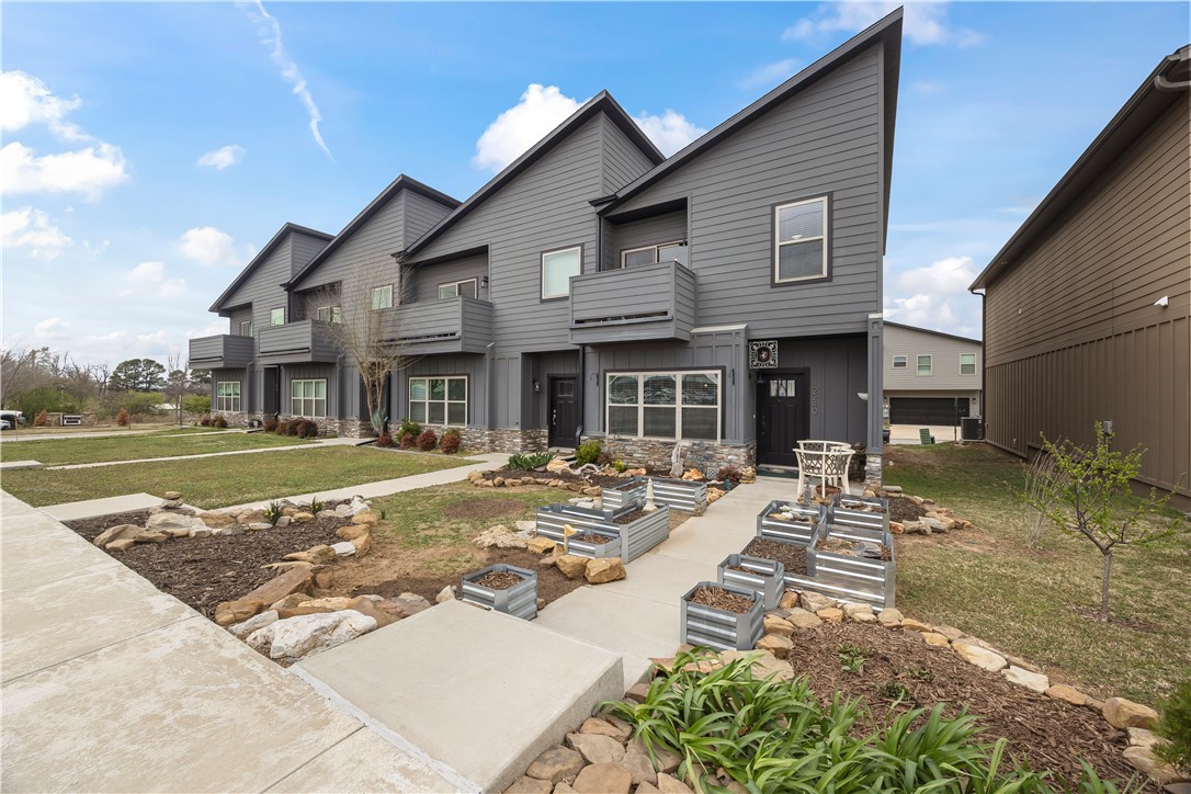Discover this 1,600 sq ft,
2-bedroom, 2.5-bathroom townhome constructed in 2021. Perfectly nestled in
an ideal location just off
of I-49 in NW Fayetteville.
This property boasts of roomy 10’ ceilings, luxury vinyl plank flooring, 6” white baseboards, stainless steel appliances and modern hardware throughout, and also features a large
two-car garage.
Both bedrooms contain a full en suite bath and large walk-in closet, perfect for roommates or guests. A standout quality
of this home is its easy accessibility to many
NWA events and locations. Consider this property a purchasing opportunity for either investors or
home-buyers looking for cozy and convenient.