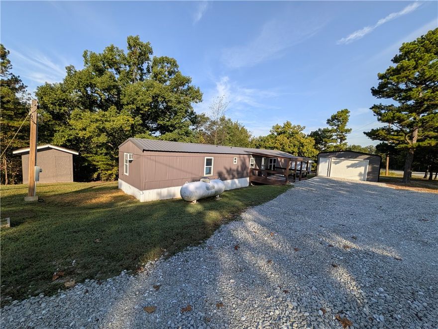 Great investment opportunity in Searcy County, Arkansas! Three income-producing units on 1.03 acres, about 10 miles north of the Buffalo National River—ideal for turnkey rentals or an owner-occupant seeking extra income.

One updated mobile home offers a 3-bedroom, 1-bath layout with modern touches and a detached garage for storage or a workshop. The second mobile is now vacant and is currently being updated. A travel trailer (RV) with updates adds flexible rental or guest space.

Each unit has separate water and electric meters for easy management and tenant billing. With individual utilities and proximity to the Buffalo National River—renowned for floating, fishing, hiking, and outdoor recreation—this property is well-positioned to attract steady demand. Whether expanding your rental portfolio or starting with income already in place, this is an opportunity you won’t want to miss.