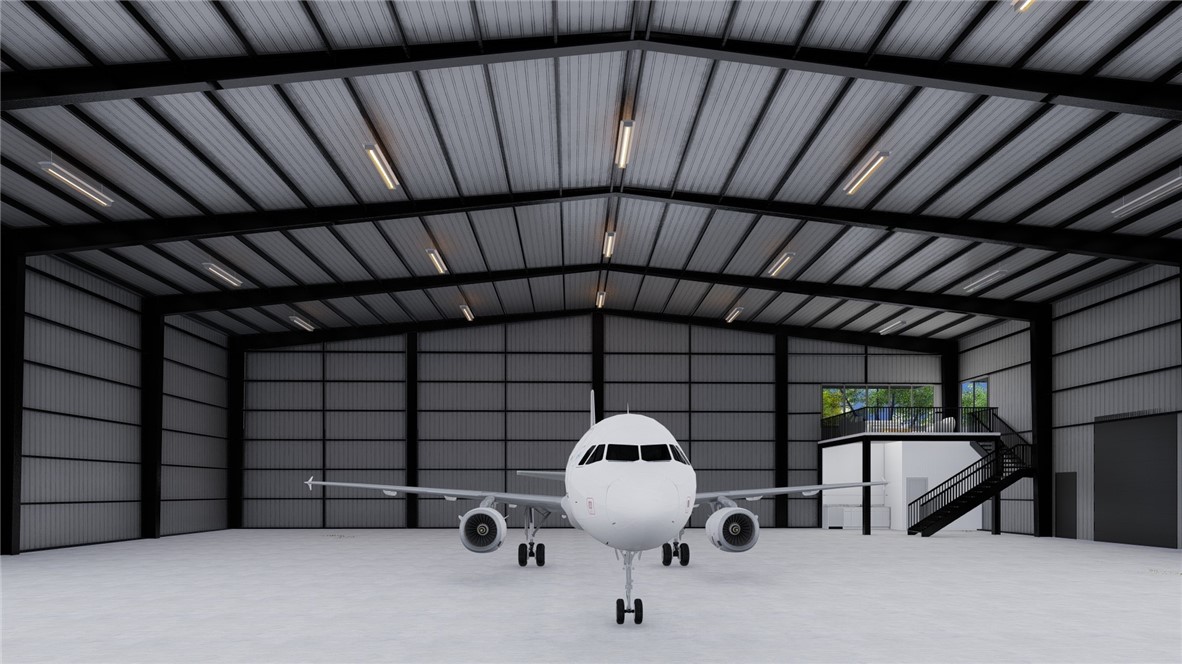 Brand new construction. Check out this new 100' x 85' hangar at the Springdale Airport to be completed December 2025. This hangar is 26' in height with a 20' x 60' Schweiss hydraulic door with remotes and a 10' x 12' drive in door. Hangar also includes a kitchenette, bathroom, and 800 sqft mezzanine lounge. It also has 7 windows on the mezzanine level area for natural light. Plenty of electrical outlets and high bay LED lighting. Back-up generator. Private entrance with secure parking.
