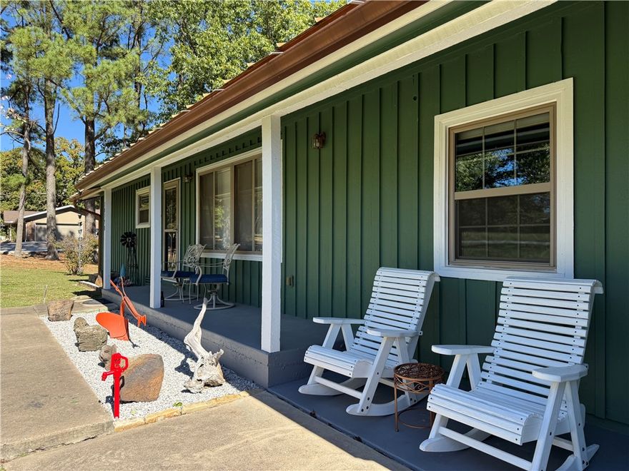 Located on 2.5 maintained acres, this property offers three bedrooms and two full bathrooms, providing an ideal balance of comfort and functionality. The home features an updated kitchen outfitted with stainless steel appliances, soft-close cabinetry, and modern finishes. A screened-in porch invites relaxation with scenic views of the surrounding landscape.
Outdoor amenities include a drive-through, insulated two-car garage equipped with a 220 outlet and a 30 amp plug on the 12x32 pad—an 18x22 carport for additional covered parking, and a dedicated woodshop with a 220 outlet for creative pursuits. For added peace of mind this home includes a storm shelter and generator. Every detail of this property has been carefully considered to offer an exceptional living experience with a park like setting.