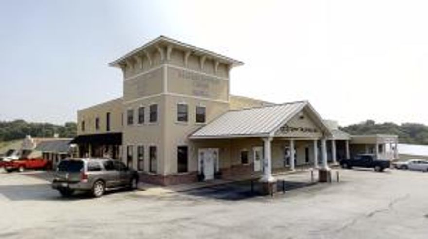 Premier investment property visible from the Hwy 65 Bypass; building has frontage on Main Street and Crandall Avenue; This listing has a total of 6 - 9 rental spaces depending on how the two large suites are rented; There is also a warehouse with a 11.6 Ft Garage Door, individual HVAC unit, Handicap Bathroom, and an office. A great commercial opportunity with steady income from 9 renters. A must see investment.