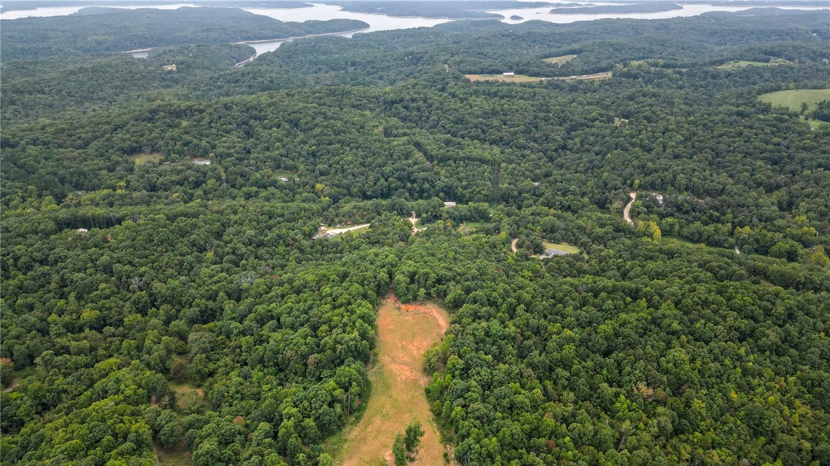 Looking for the next place to build your dream home? This is it!! Check it out, 7.5 acres on a paved road with easy access. Has some flat spots just past the tree line waiting for your dream home! Just 10 minutes to Pebble Beach, 20 minutes to Prairie Creek Marina, and 15 minutes to Lake Atlanta. The back acreage is prime space for hunting! Opportunities like this don't come around often.